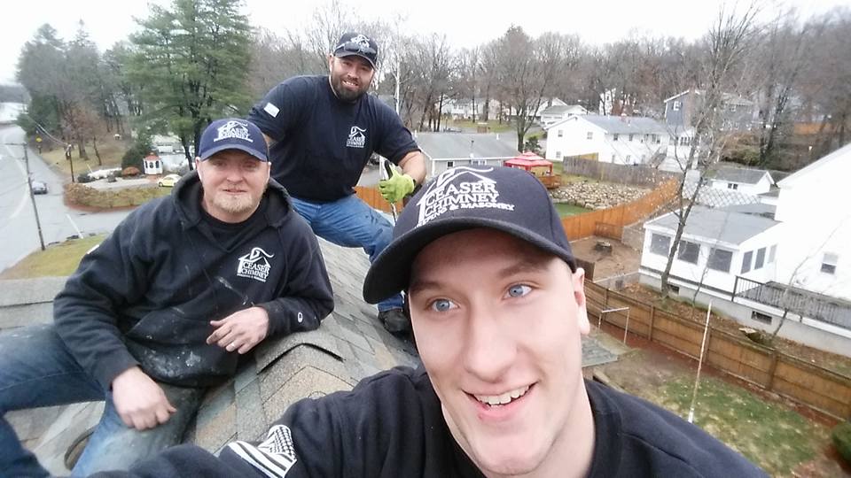 3 men on a roof working