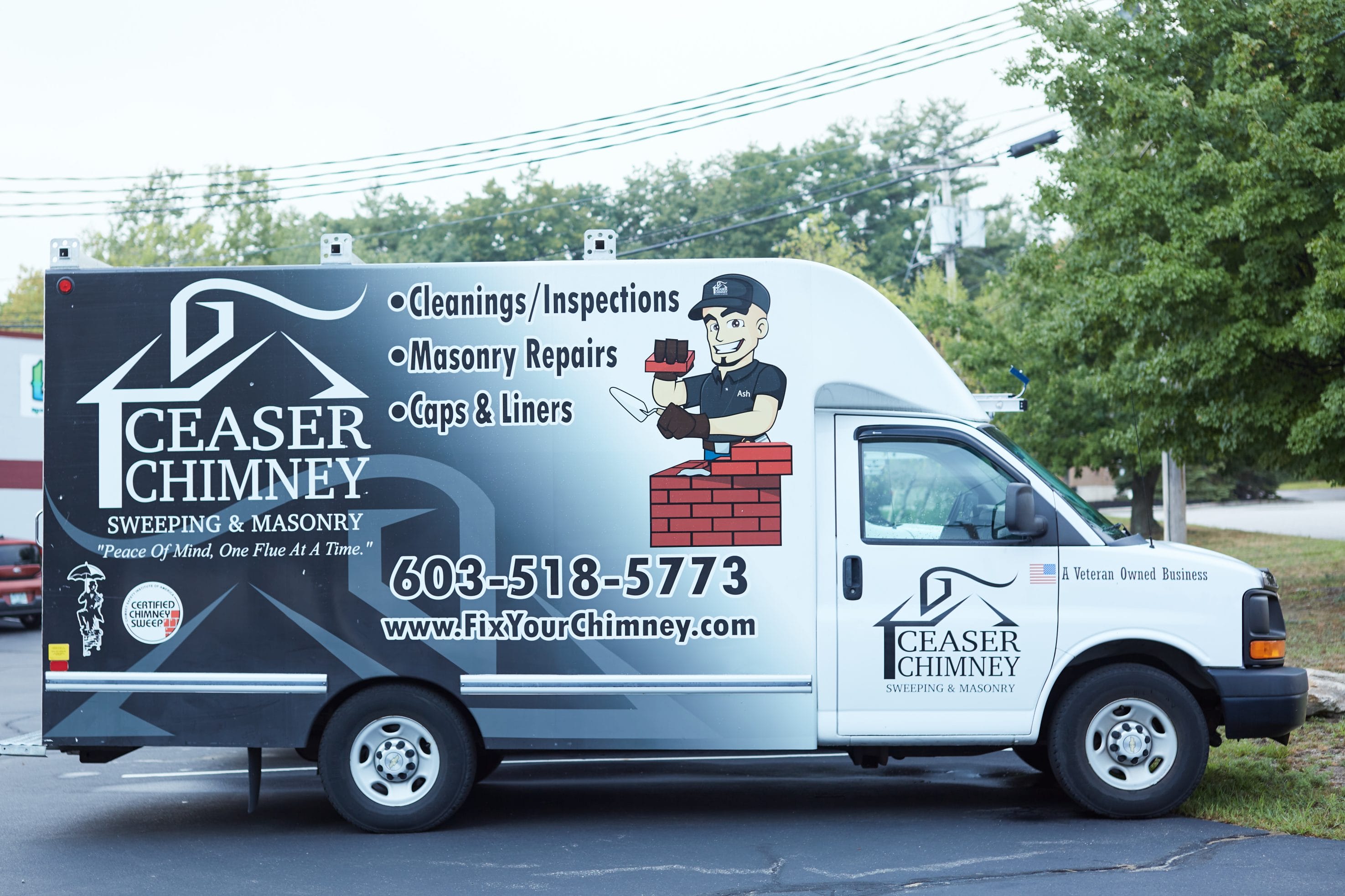 Original photo of a Ceaser Chimney work truck with their name, info, and contact number.